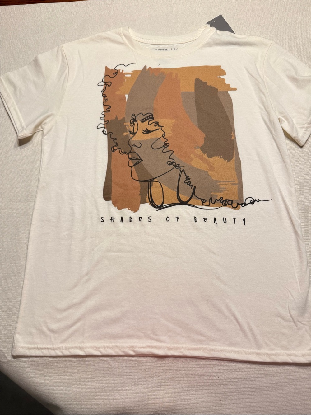 Modern Lux Cream Graphic Tee with Brown & Tan Artwork